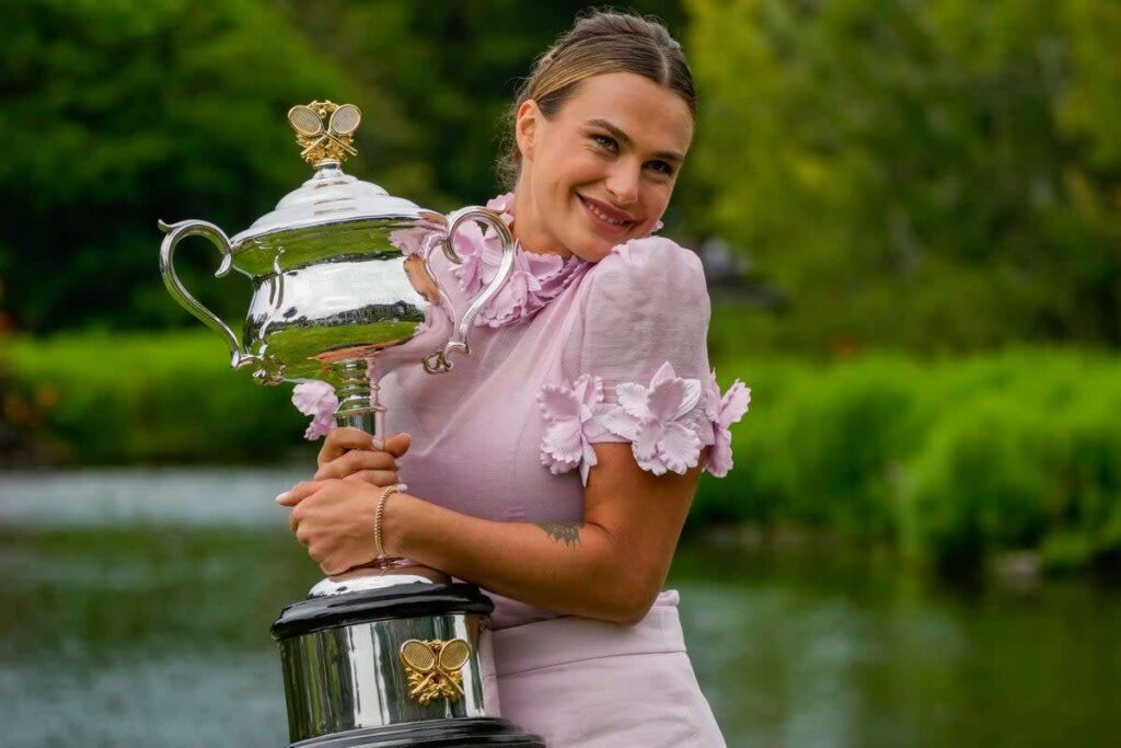 Sabalenka celebrates her first Grand Slam trophy.